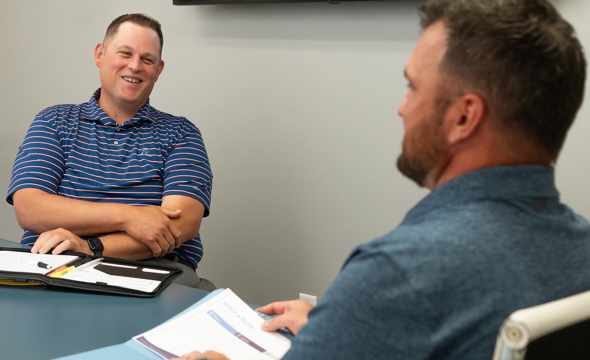 Advisor Nicholas St. George with a client